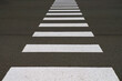 Zebra pedestrian crossing on the asphalt.