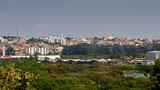 Fototapeta Na sufit -  Landscape on top of a mountain showing the buildings and houses of the city