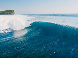 Canvas Print - Aerial view with surfing on ideal wave. Blue perfect waves and surfers in ocean