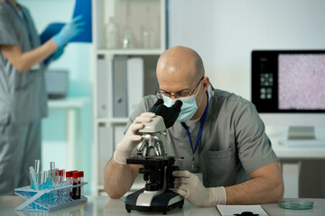 Poster - Concentrated lab worker analyzing blood cells