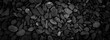 Dark black abstract smooth round pebbles sea texture background