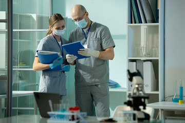 Poster - Medical colleagues reading records of patient