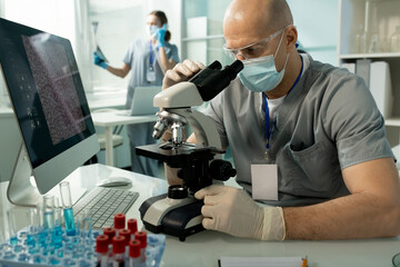 Poster - Bald man focused on medical research