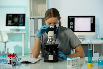 Poster - Busy researcher working with samples in laboratory