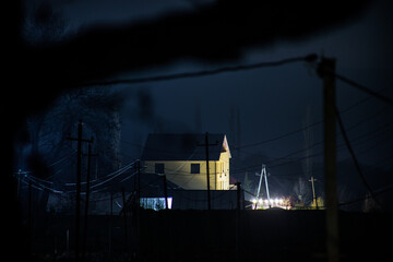 Wall Mural - full moon over quiet village at night. beautiful night landscape of mountain village under the moonl