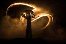 Creative Artwork Decoration. Silhouette Of Army Watchtower At Night. Selective Focus