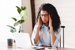 © InsideCreativeHouse - Exhausted african-american businesswoman having headache in office. Bored young african girl tired of learning sit at home looking at laptop,  apathetic black female university student frustrated