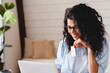 © InsideCreativeHouse - Young african businesswoman doing shopping online using laptop and credit card. African-american woman doing orders through the Internet