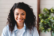 © InsideCreativeHouse - Successful young african woman operator and call center worker. Smiling woman employee wear headphones, talking with clients, consulting customer, giving online educational class, watching webinar