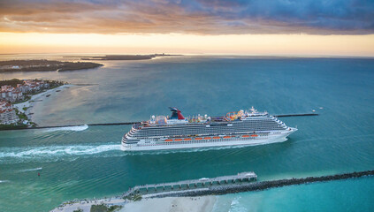 Canvas Print - Cruise ship departs from Miami Port at sunset, aerial view