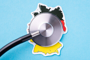 Wall Mural - Drum part of stethoscope on a map of Germany. Concept of health of citizens of the country