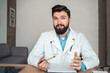 © Stock 4 You - Young caucasian male doctor talking to video camera explaining pov headshot