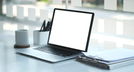 Wall Mural - Modern workspace with computer with blank screen and equipment on white table.Blank screen for your information.