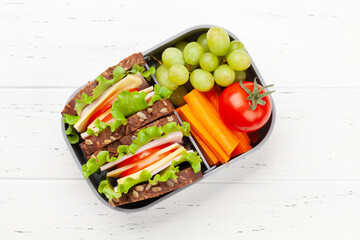 Wall Mural - Healthy school lunch box with sandwich and fresh vegetables