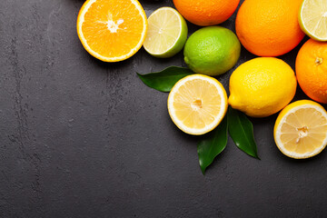 Wall Mural - Fresh ripe citrus fruits on stone background