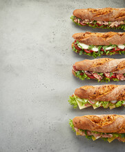 Row Of Fresh Sandwiches On Table