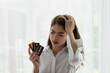 © surachetkhamsuk - Young Asian business woman holding credit card with feeling unhappy, Financial problem concept