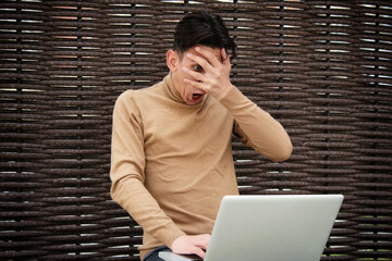 Funny young man with laptop. Freelancer and web design. Business strategy. Online training in the fresh air.