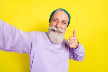 Sticker - Photo portrait of elder man showing like thumb-up gesture smiling isolated on bright yellow color background