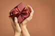 © Rido - Woman holding elegant gift box