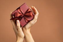 Woman Holding Elegant Gift Box