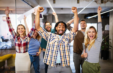 Wall Mural - Happy business people celebrating success at company