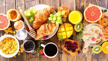 Wall Mural - breakfast with coffee cup with croissants and fruits