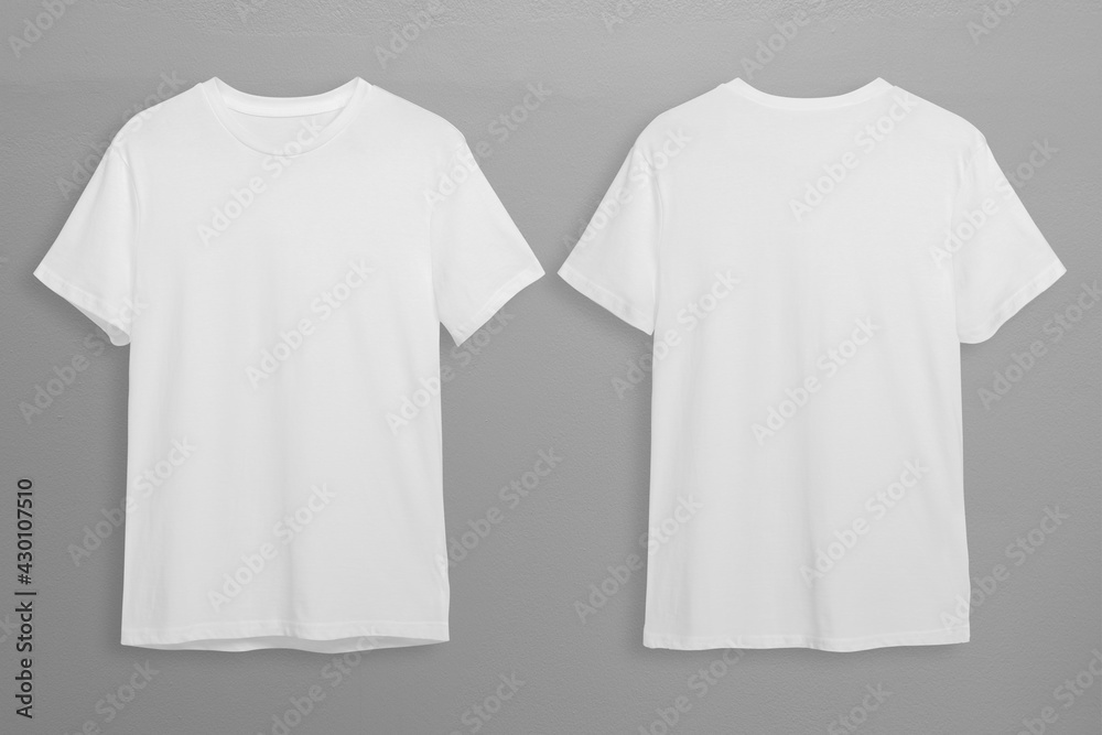 White t-shirts with copy space on gray background - obrazy, fototapety, plakaty 