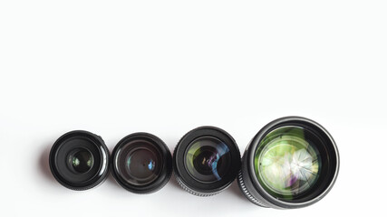 Wall Mural - Modern camera lenses with reflections, white background. copy space