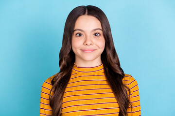 Canvas Print - Photo of satisfied carefree school girl smile look camera isolated on pastel blue color background