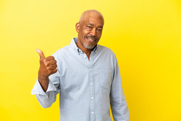 Sticker - Cuban Senior isolated on yellow background pointing to the side to present a product