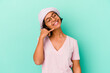 © Asier - Young mixed race woman isolated on blue background showing a mobile phone call gesture with fingers.