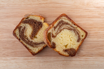 Wall Mural - Overhead view of two slices of a freshly baked cinnamon marble pound cake