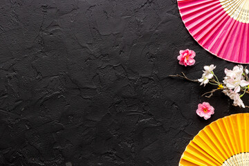 top view of two hand fans made of bamboo and paper