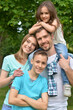 © aletia2011 - Portrait of happy young family in summer  park