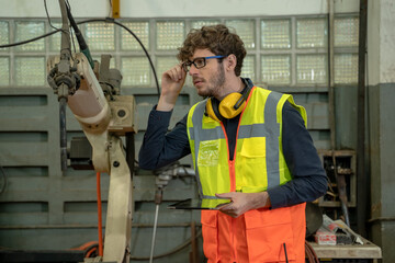 Aufkleber - Industrial engineer working in a industrial manufacturing factory.