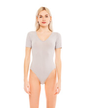 Portrait Of A Young Blonde Woman In Gray Bodysuit
