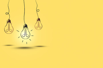Poster - illustration of hanging glowing light bulb on yellow background and copy space.