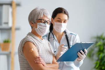 Wall Mural - Senior woman after vaccination.