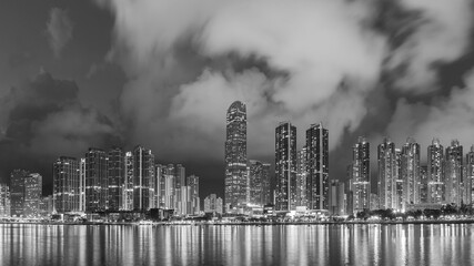  Panorama of skyline and Harbor of midtown of Hong Kong city at dusk