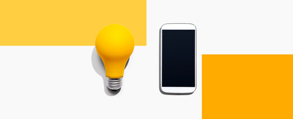 Smartphone with a yellow light bulb