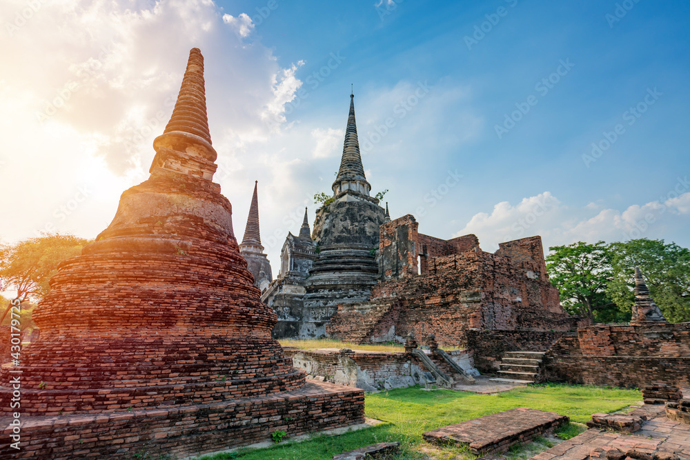 Ancient temple in Ayutthaya, Thailand. The temple is on the site of the old Royal Palace of ancient capital of Ayutthaya - obrazy, fototapety, plakaty 