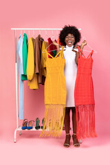 Emotional Shopaholic Woman Shouting Choosing Between Two Dresses, Studio Shot