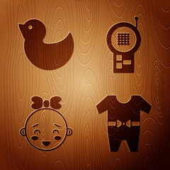 Sticker - Set Baby clothes, Rubber duck, Happy little girl head and Baby Monitor Walkie Talkie on wooden background. Vector