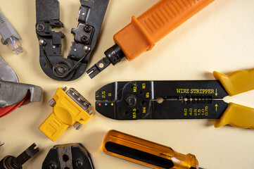 Different electrical tools on yellow background. Top view.