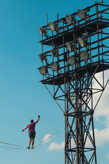 Wall Mural - Highliner on the background of blue sky.