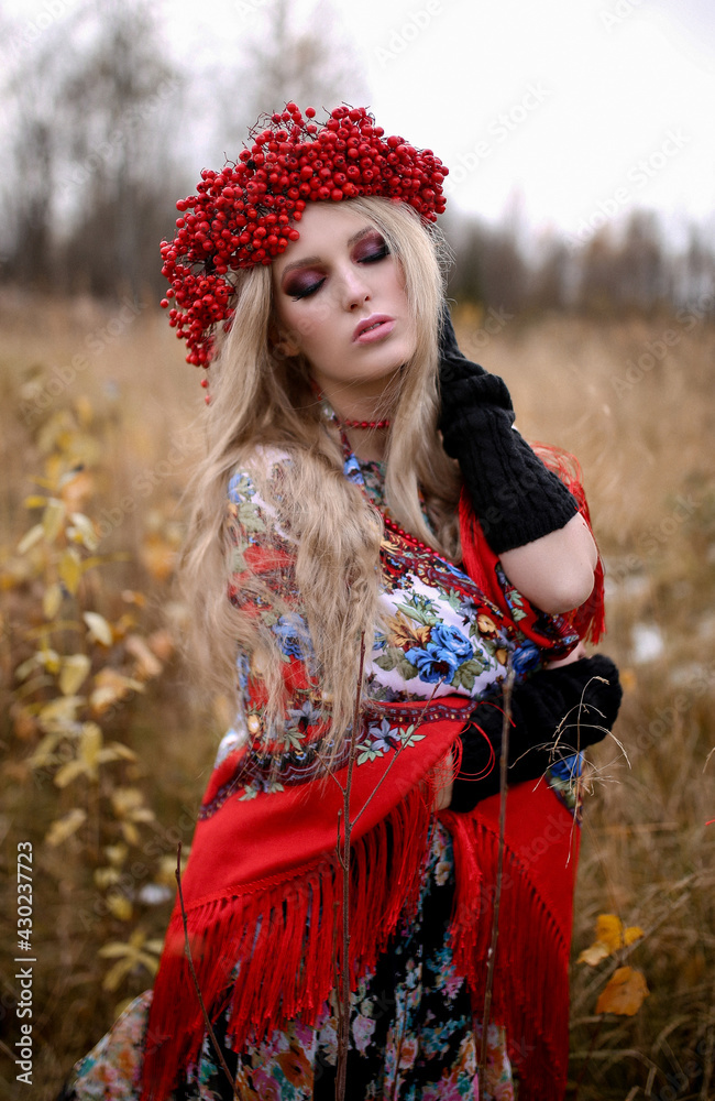 A beautiful Slavic girl with long blond hair and blue eyes with a