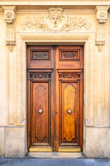 Wall Mural - Paris, an ancient wooden door, typical building in the 11e arrondissement
