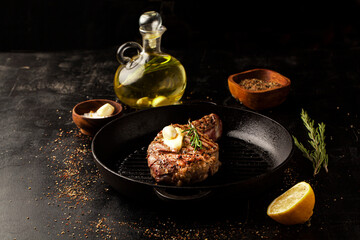 Sticker - Grilled beef steak in a grill pan with rosemary, garlic and spice