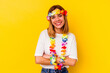 © Asier - Young caucasian woman celebrating a hawaiian party isolated on yellow background laughing and having fun.